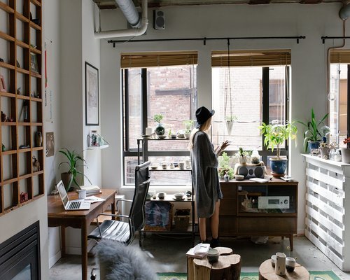 A modern shared creative workspace in downtown Santiago featuring soft ambient lighting and large desks